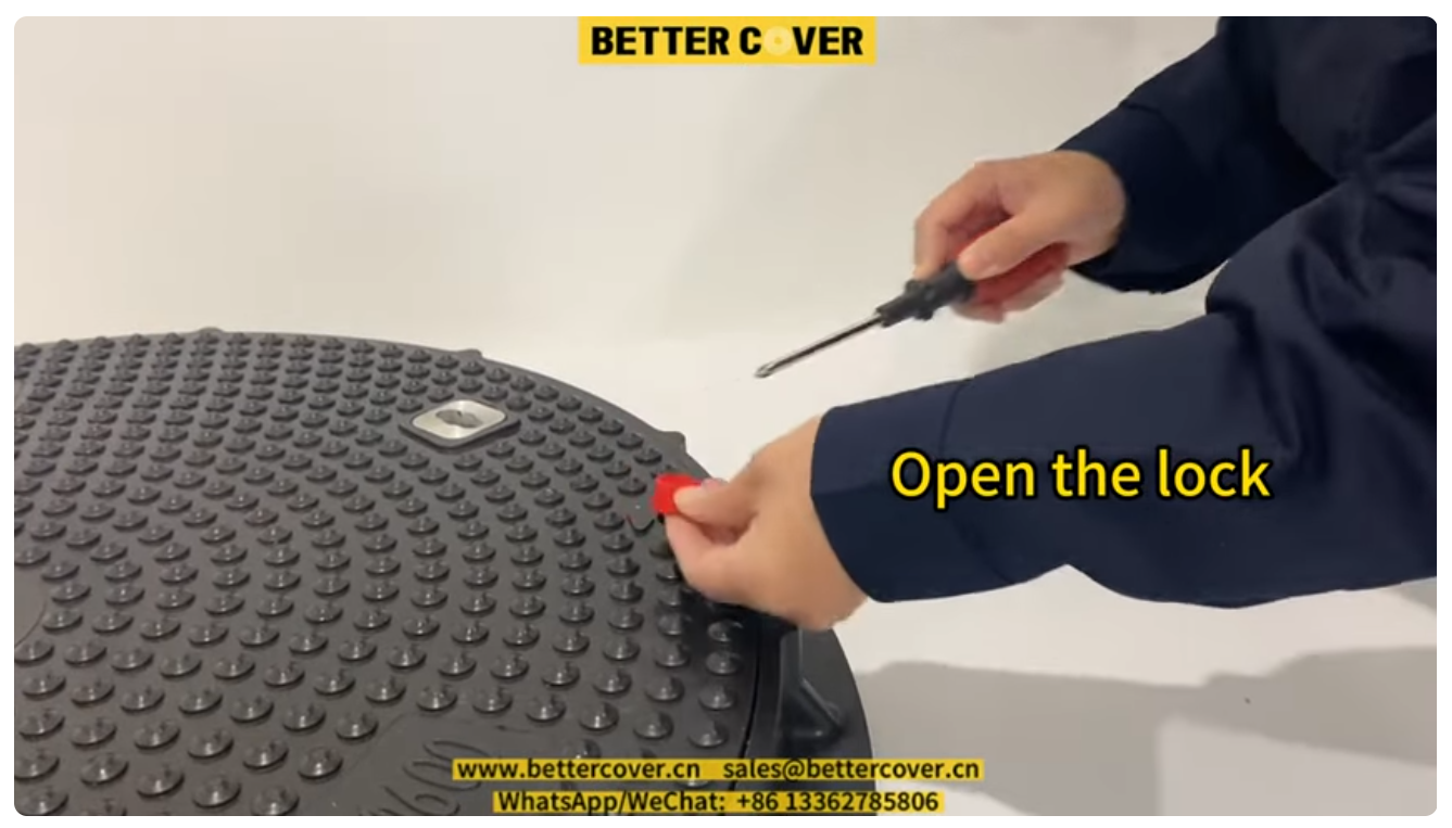 How to open a locked composite manhole cover and frame.